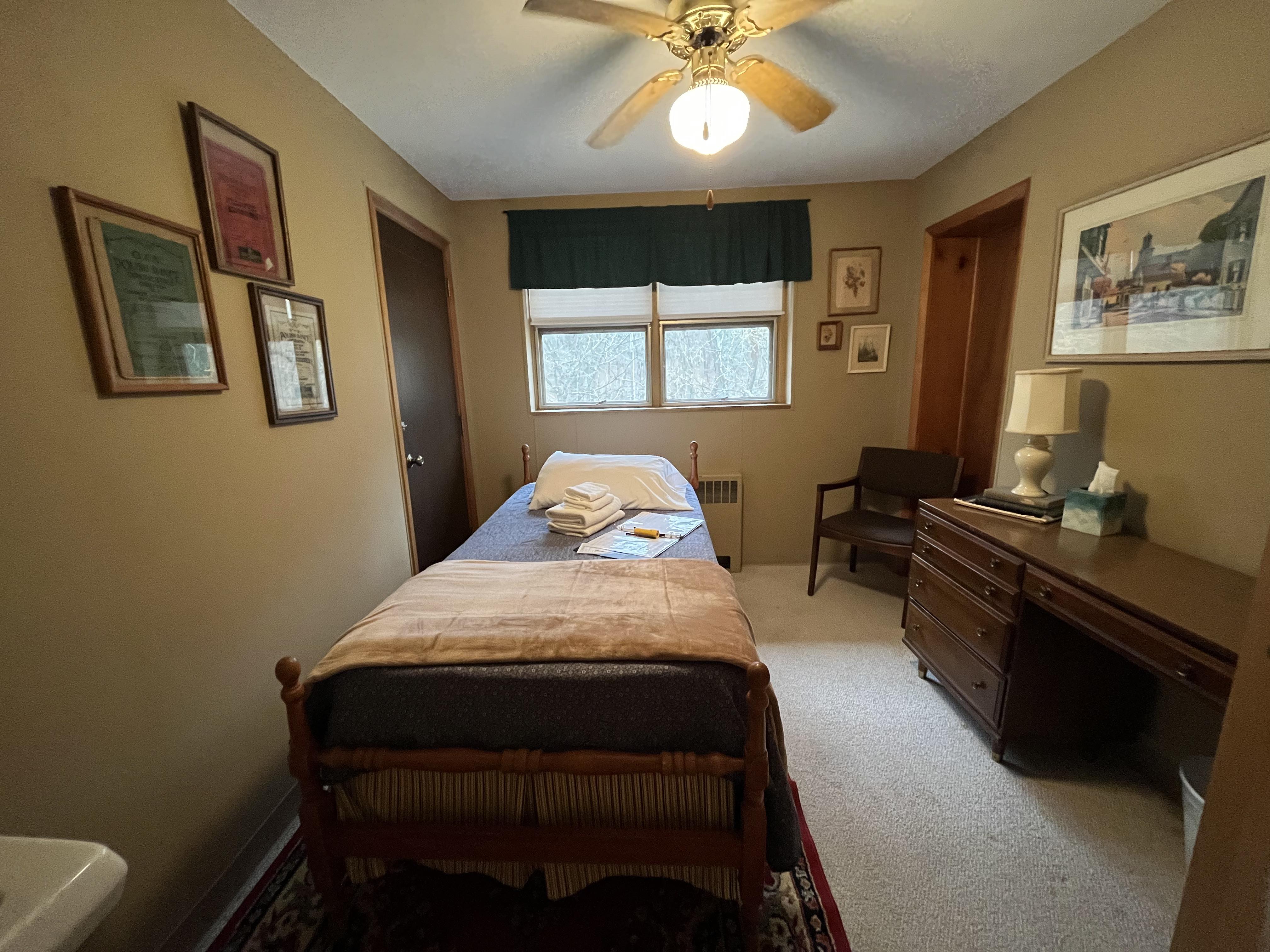 East Wing bedroom with single bed and desk